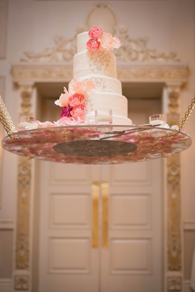 Suspended wedding cake with pink handcrafted flowers. rebeccachan.ca