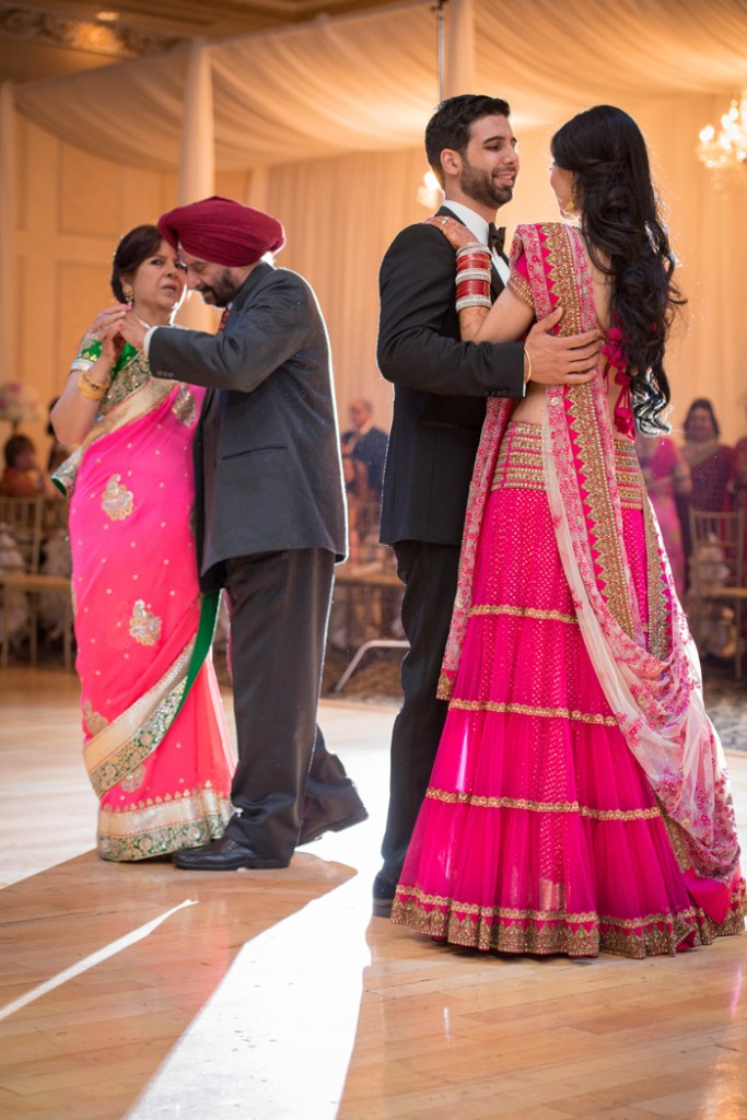 Newlyweds share a first dance with their parents. rebeccachan.ca