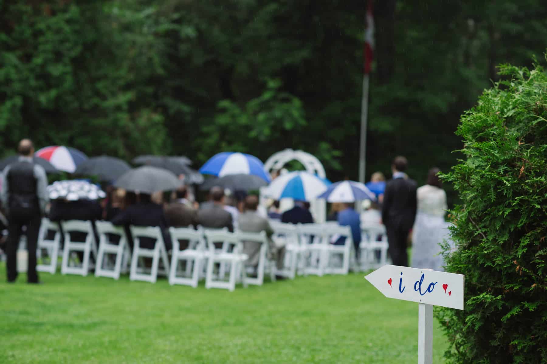 Backyard tented Ontario wedding ceremony and I Do sign. See more at Rebecca Chan Weddings and Events https://rebeccachan.ca