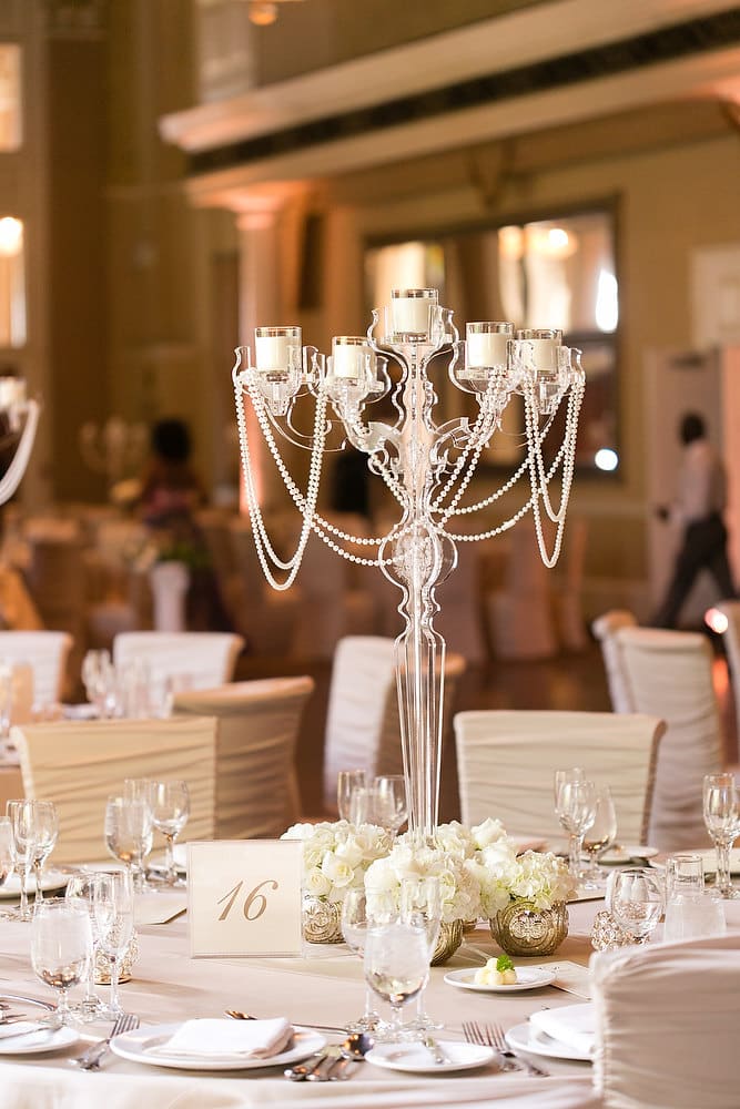 Classic ivory and champagne wedding centrepiece at Liberty Grand. See more at Rebecca Chan Weddings and Events https://rebeccachan.ca