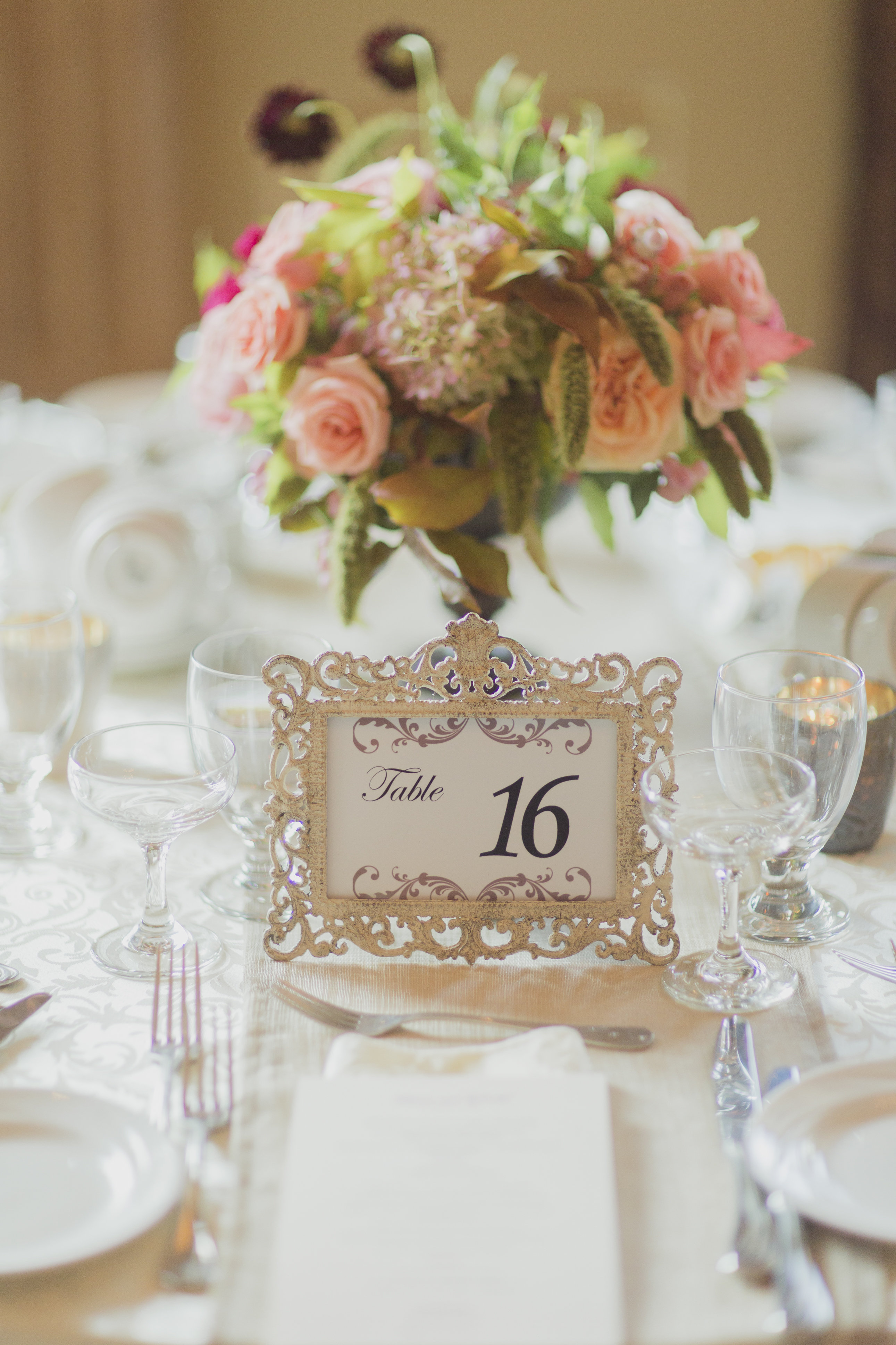 Romantic cranberry and blush floral centrepiece and gold framed table number. See more at Rebecca Chan Weddings and Events https://rebeccachan.ca