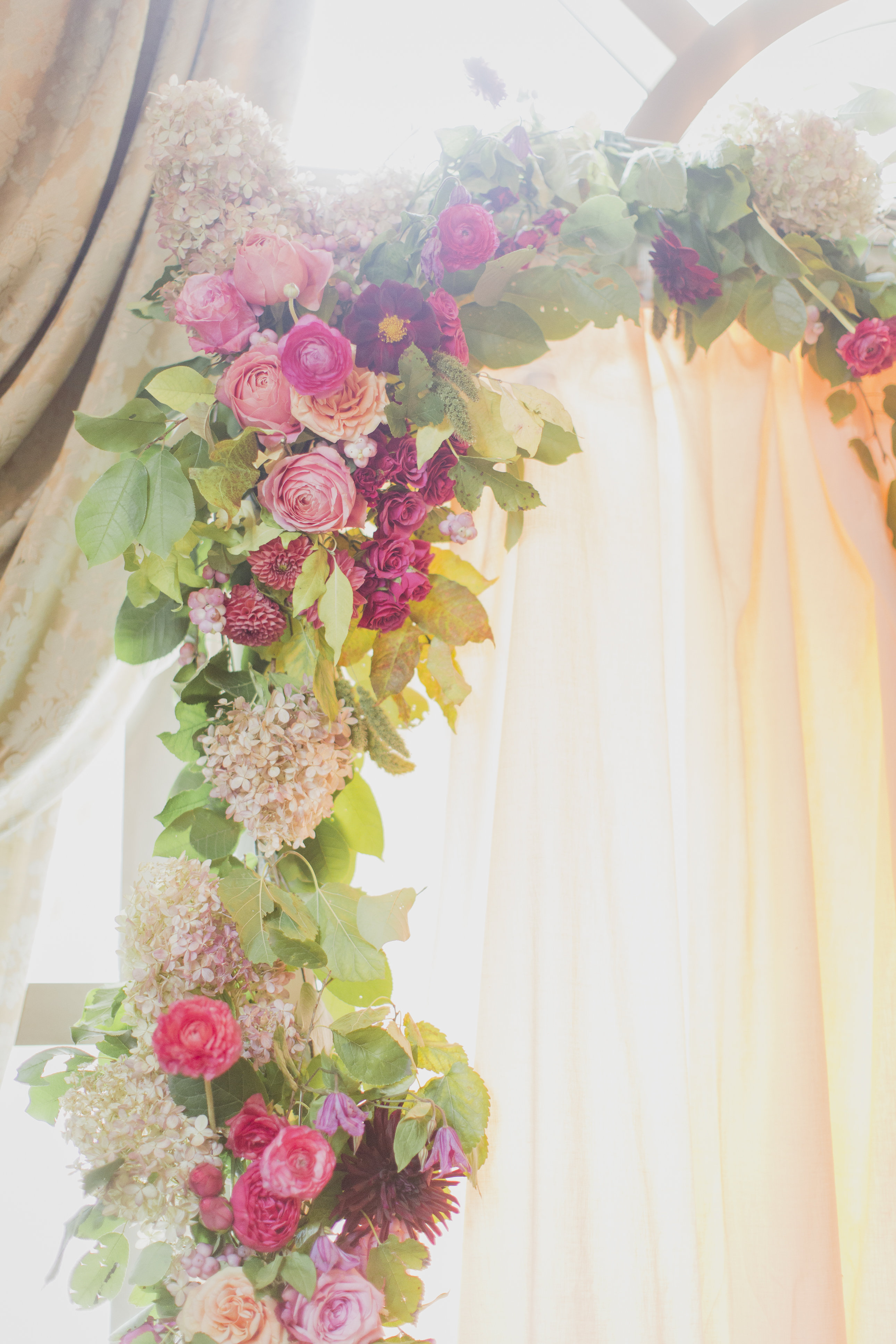 Romantic cranberry and blush floral garland for the wedding ceremony. See more at Rebecca Chan Weddings and Events https://rebeccachan.ca