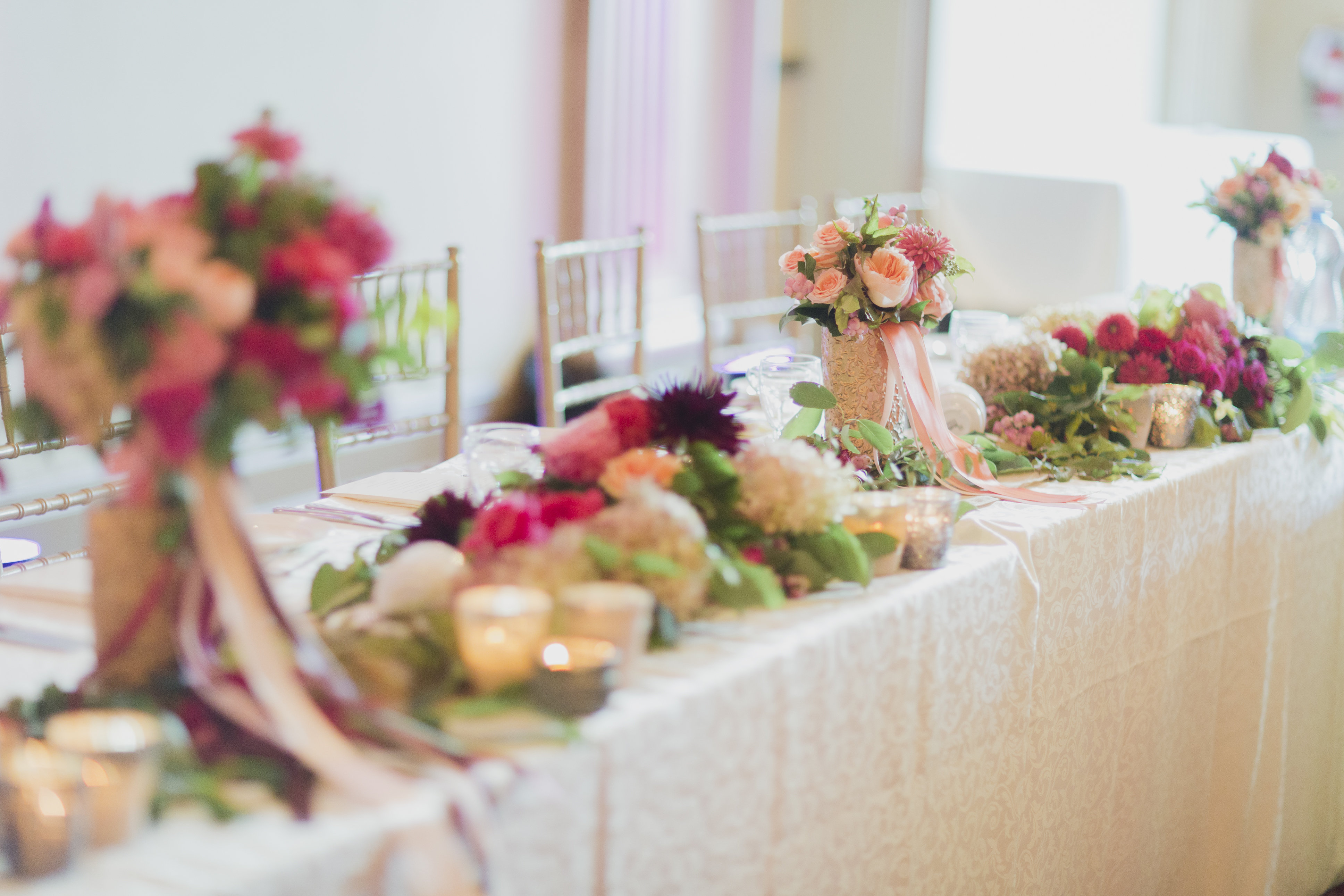 Romantic cranberry and blush floral garland at the head table. See more at Rebecca Chan Weddings and Events https://rebeccachan.ca