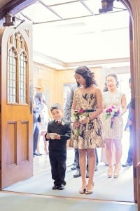 Elegant vintage-inspired purple and gold wedding - Ring boy holding rings in a tea cup