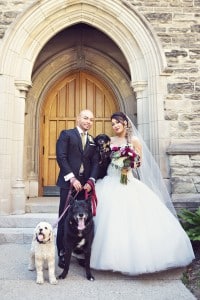 Elegant vintage-inspired purple and gold wedding - Photo with their three dogs