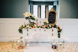 Estates of Sunnybrook indoor ceremony inspiration - floral garland and vintage vanity
