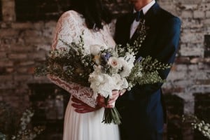 Intimate Burroughes Building wedding with string lights and lavender