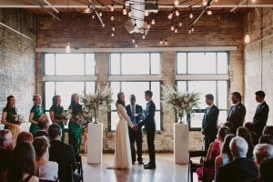 Intimate Burroughes Building wedding with string lights and lavender