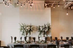 Intimate Burroughes Building wedding with string lights and lavender