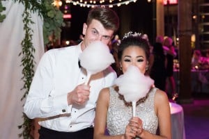 Bride and groom with cotton candy Romantic Rustic Wedding at the Steam Whistle Brewery