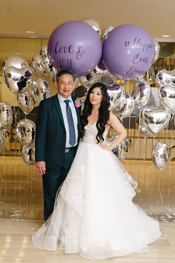 Modern Arcadian Court wedding - balloon entrance