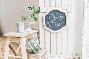 Estates of Sunnybrook open house - Vintage bicycle vignette with window shutters seating chart and balloons