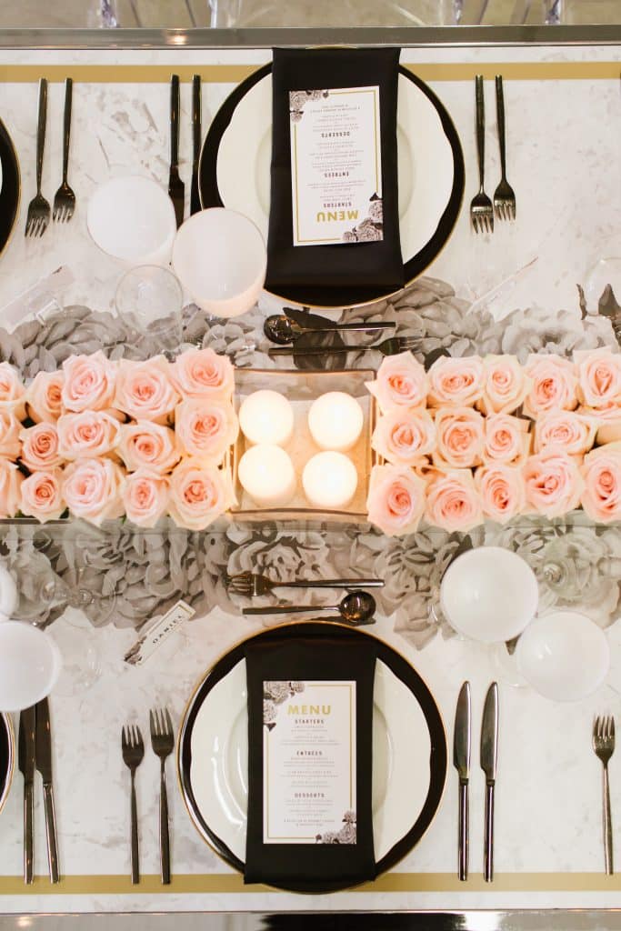 Modern and masculine corporate tabletop design with pink roses and vinyl