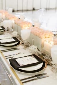 Modern and masculine corporate tabletop design with pink roses and vinyl