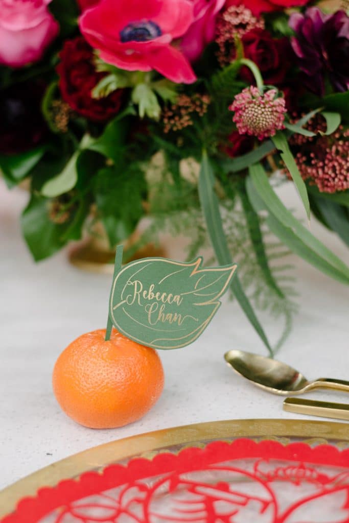 Custom leaf name card on mandarin orange - Chinese New Year decorating ideas as seen on Breakfast Television with Rebecca Chan Weddings and Events rebeccachan.ca