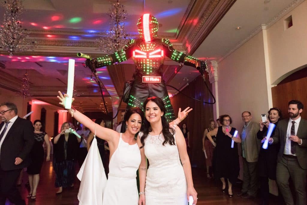 Elegant wedding with two brides and a robot at Rosewater Room 