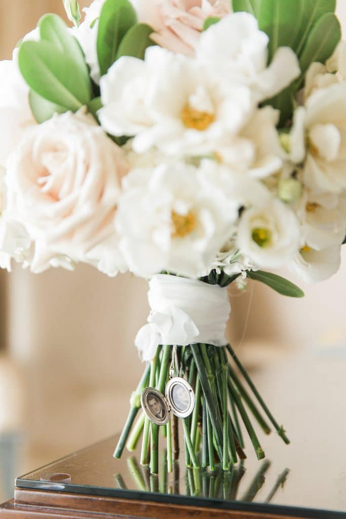 White bridal bouquet with locket