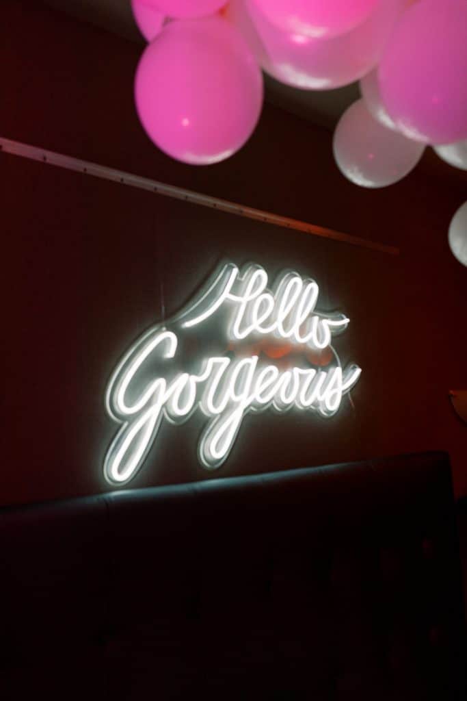 Neon sign for Hello Gorgeous, in the Electric Bedroom photobooth