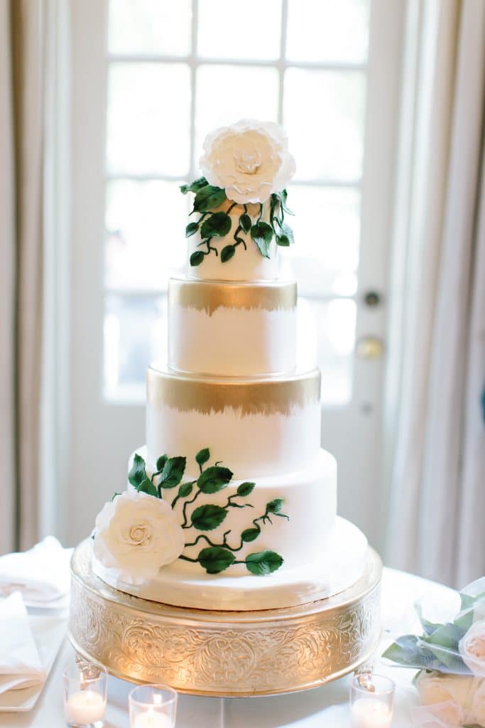 White wedding cake with gold details at Graydon Hall Manor