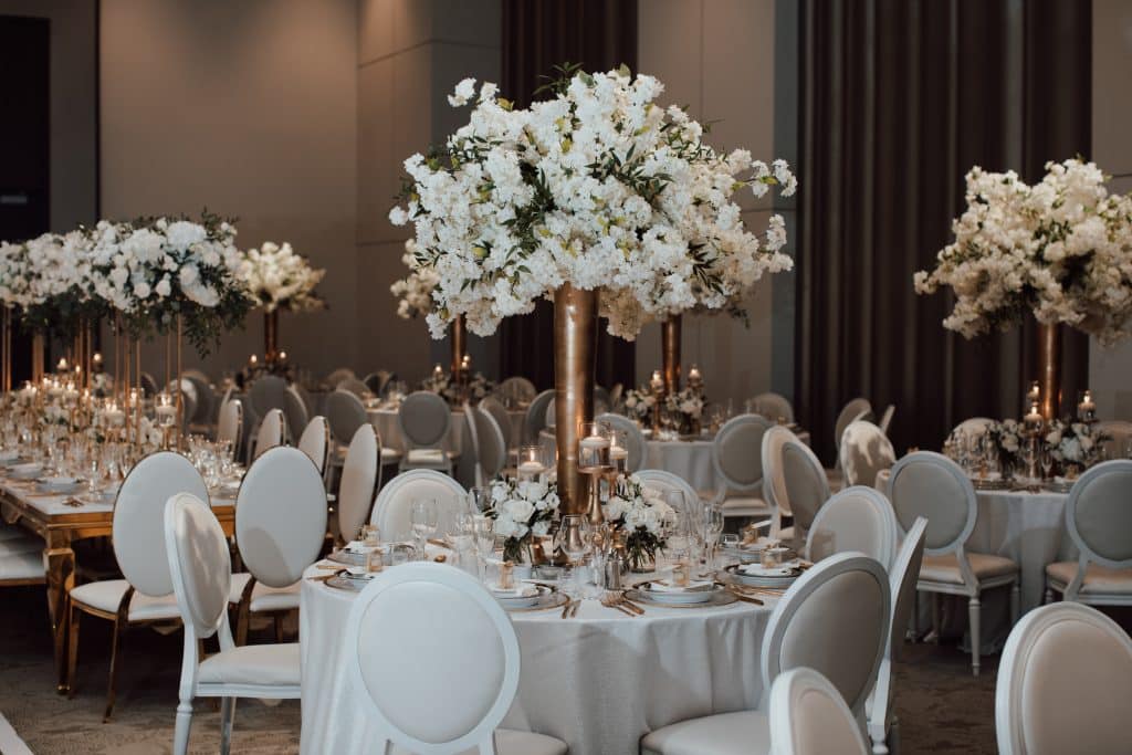 A luxurious white wedding with chery blossoms for NHL player Mike Hoffman wedding.