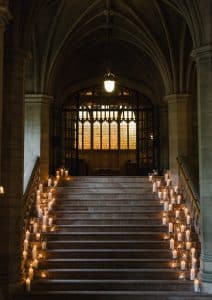Wedding ceremony at Knox College Chapel, with candlelit stairs. Planned by Rebecca Chan Weddings & Event, rebeccachan.ca