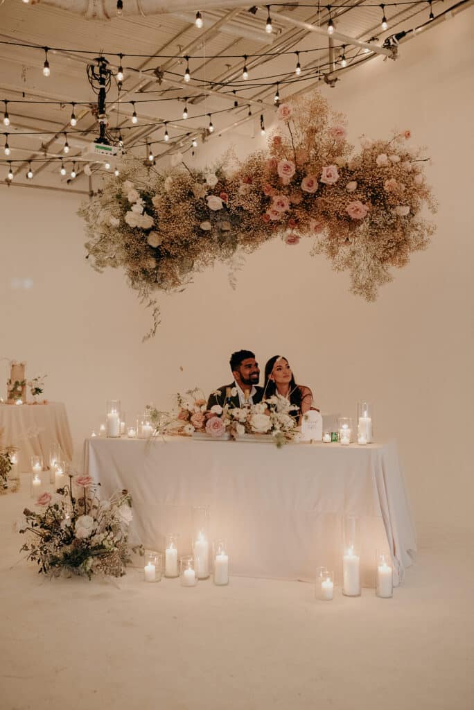 Couple at head table - Whimsical and dreamy cloud wedding at District 28. Planning by Rebecca Chan Weddings & Events rebeccachan.ca