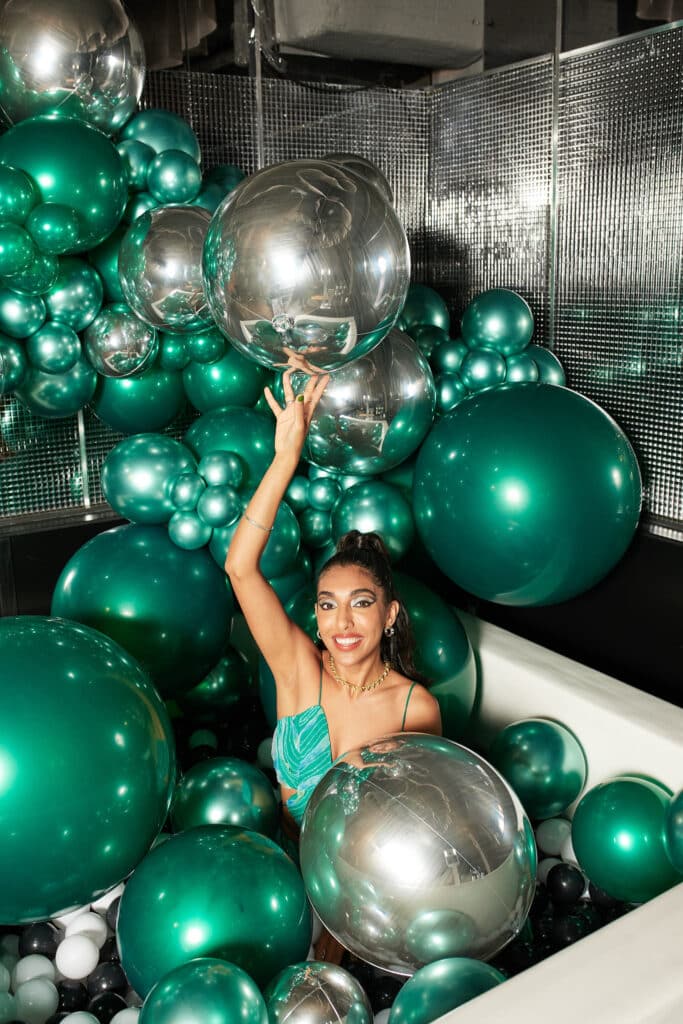 Emerald and silver balloon ball pit photo booth - Rupi Kaur's 30th birthday party; Planned by Toronto event planner, Rebecca Chan Events