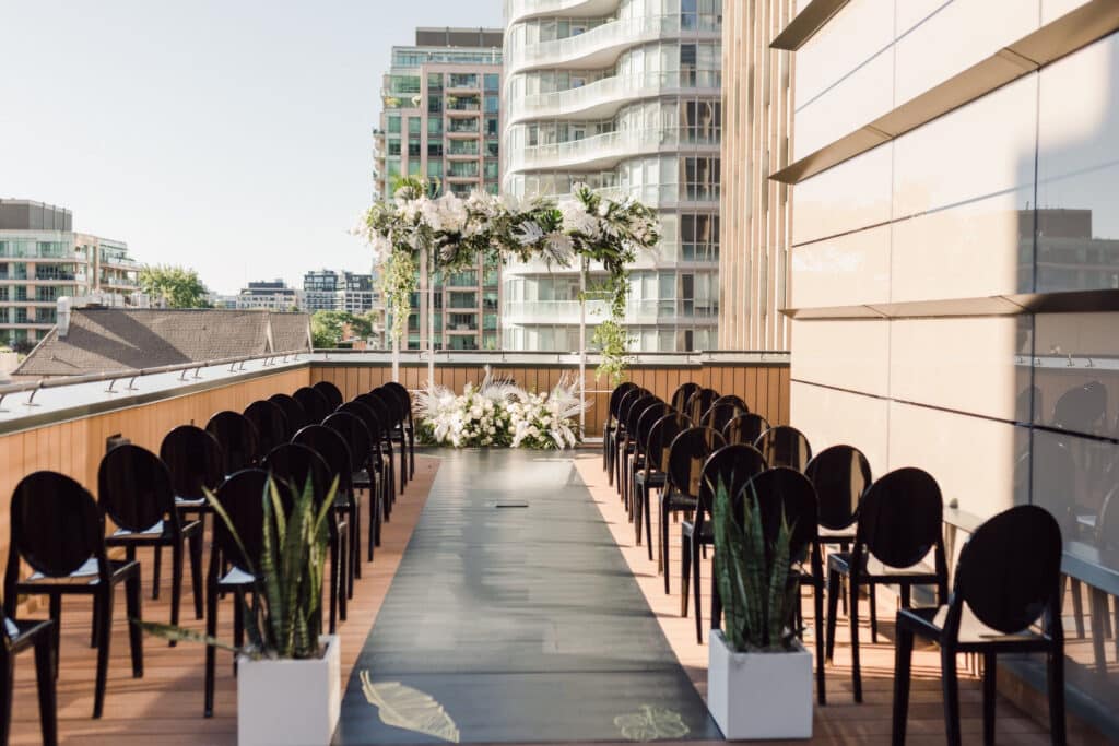 Tropical wedding for two grooms at Harry Rosen. Planned by Rebecca Chan Weddings & Events