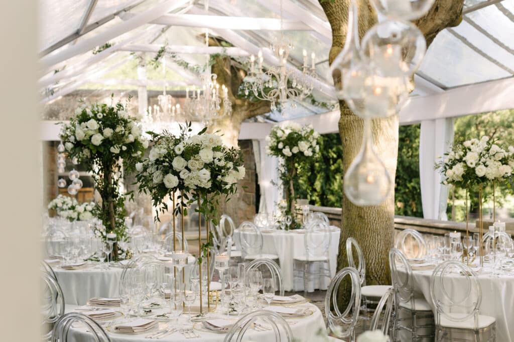 Graydon Hall Manor Wedding - Reception on the Terrace with white roses and greenery. Planned by Rebecca Chan Weddings & Events