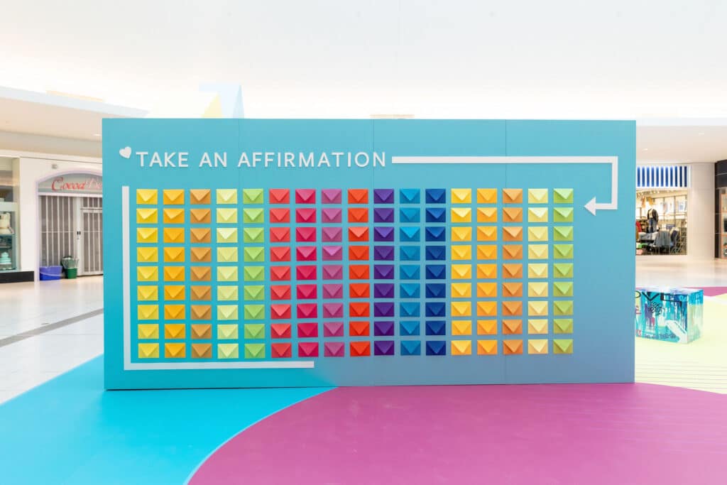 Corporate event design ideas to transform your brand: Creating interactive areas for guests like this envelope affirmation wall