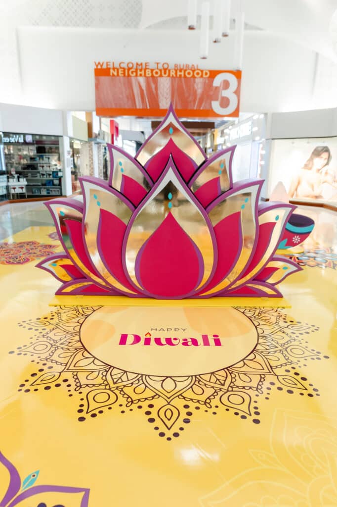 Toronto mall activation celebrating Diwali - A beautiful lotus design with 3D diya candles and vibrant rangoli pattern floor vinyl