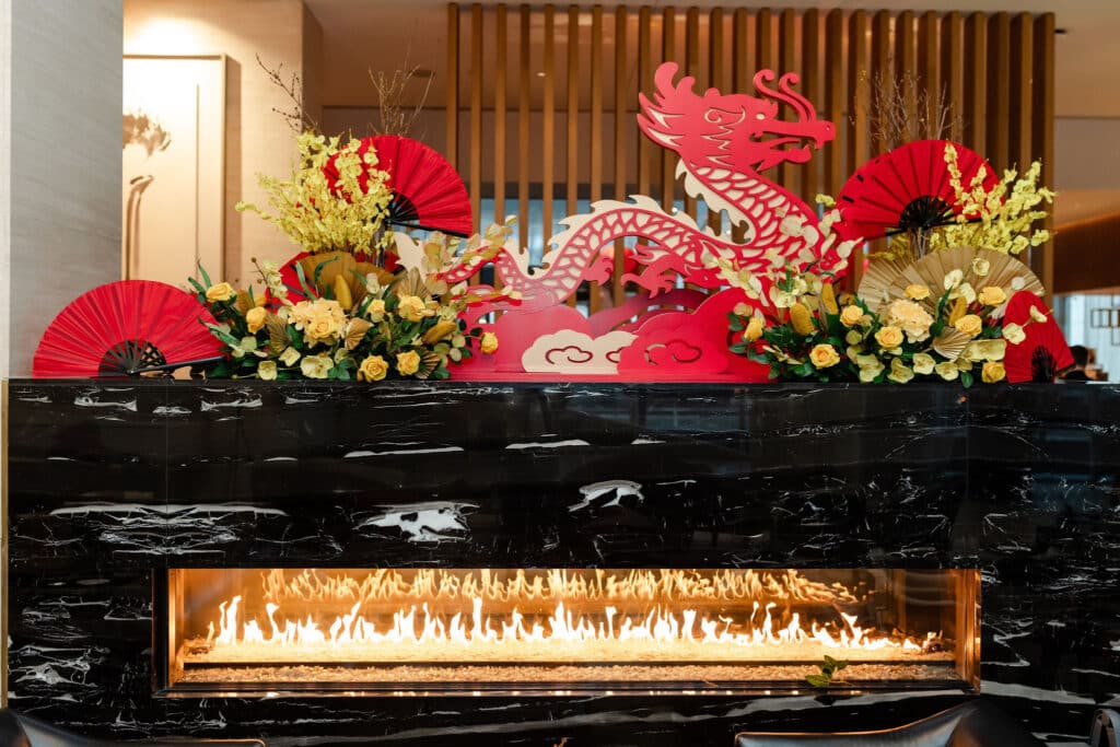 Shangri-La Hotel Toronto's lobby activation celebrating Lunar New Year, with lanterns, dragon and flowers, designed by Rebecca Chan Events.