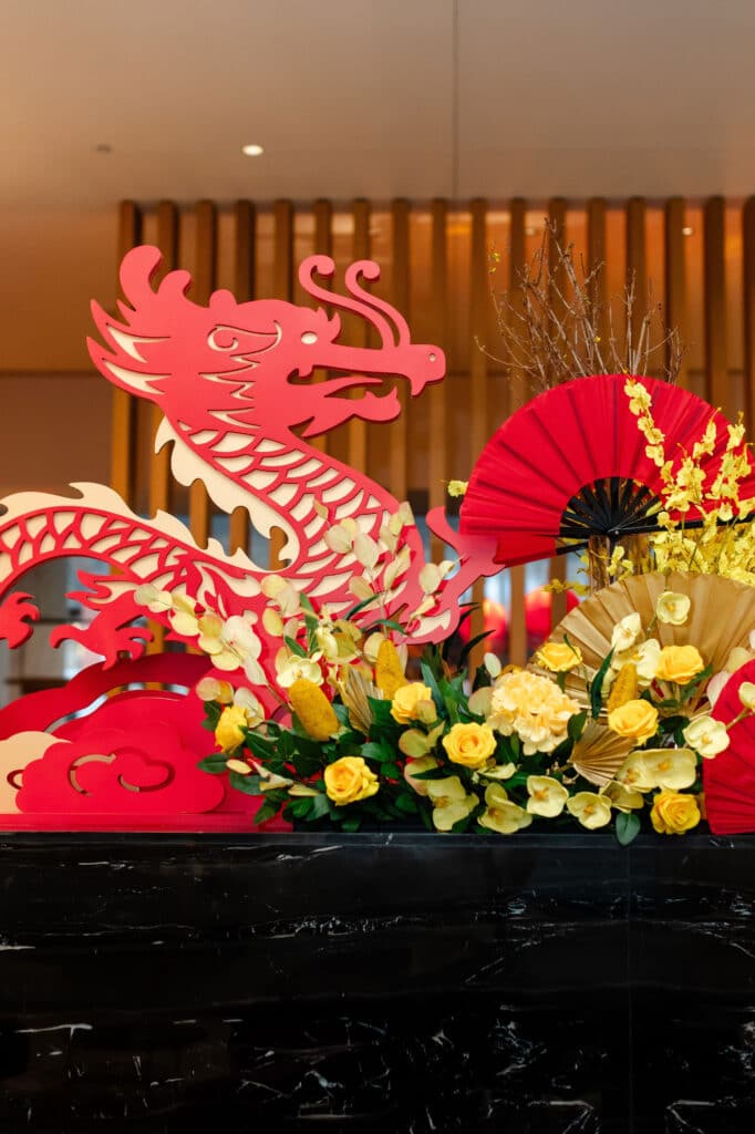 Shangri-La Hotel Toronto's lobby activation celebrating Lunar New Year, with lanterns, dragon and flowers, designed by Rebecca Chan Events.