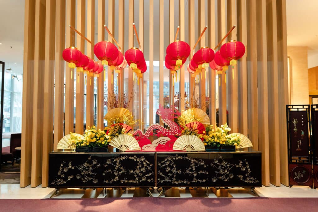 Shangri-La Hotel Toronto's lobby activation celebrating Lunar New Year, with lanterns, dragon and flowers.