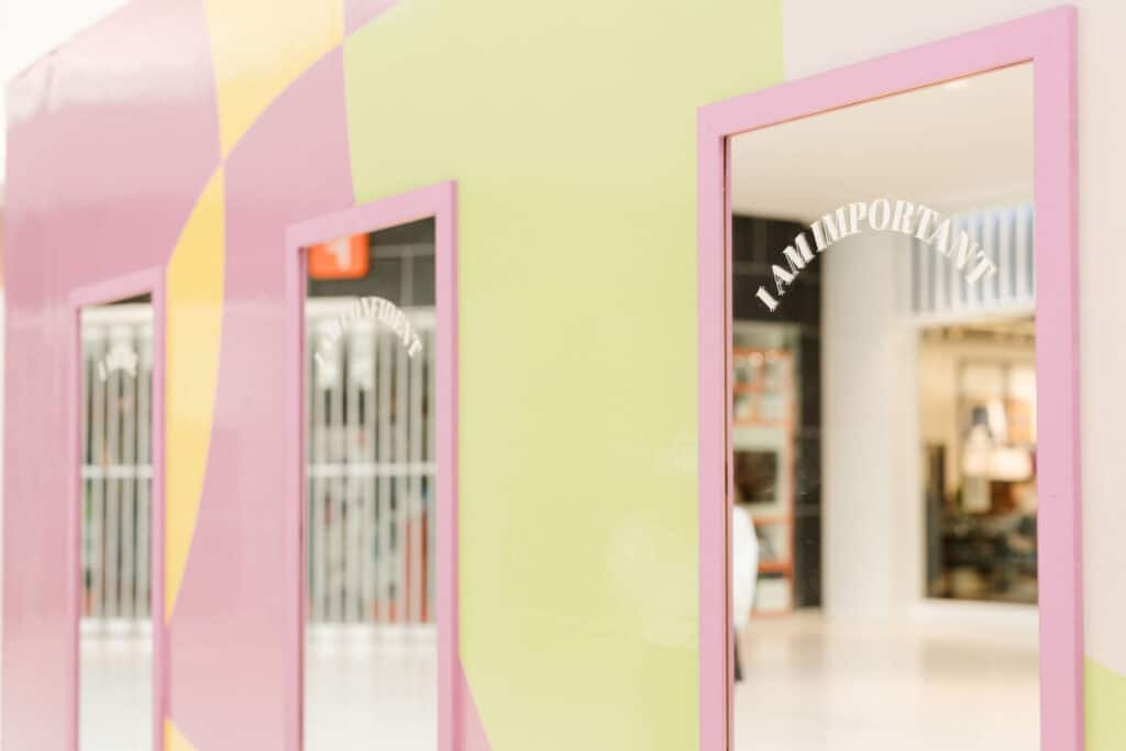 Affirmation messages on mirrors at a mall activation with Oshawa Centre