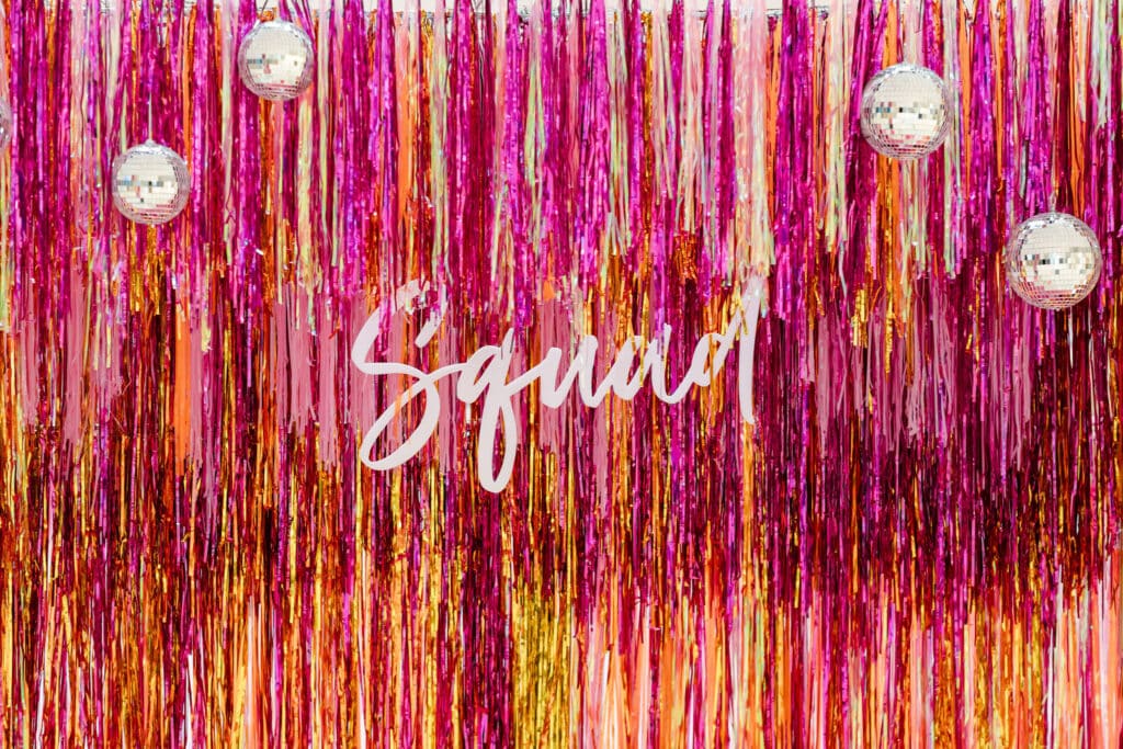 Prom decor idea: Custom made pink and orange fringe backdrop with disco balls and balloons - Prom pop up at Upper Canada Mall