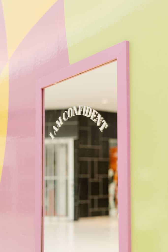 Affirmation messages on mirrors at a mall activation with Oshawa Centre