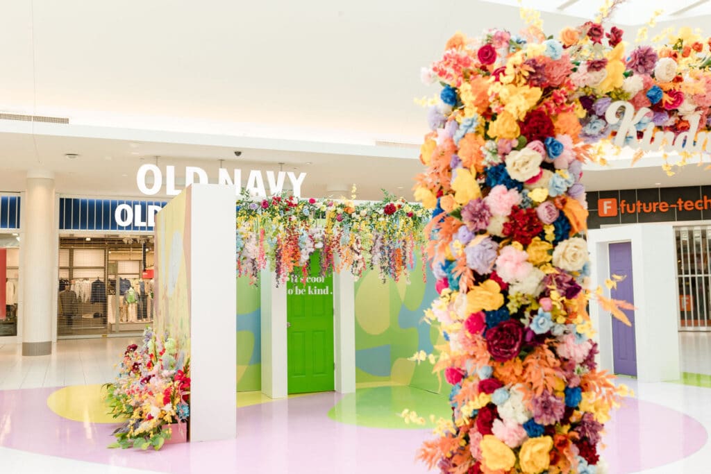 Keys to kindness mall activation with hanging flowers at Oshawa Centre