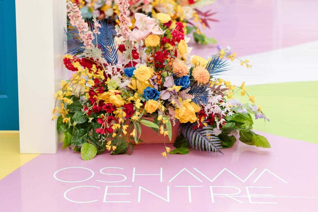 Kindness Garden mall activation with positive messages on doors at Oshawa Centre