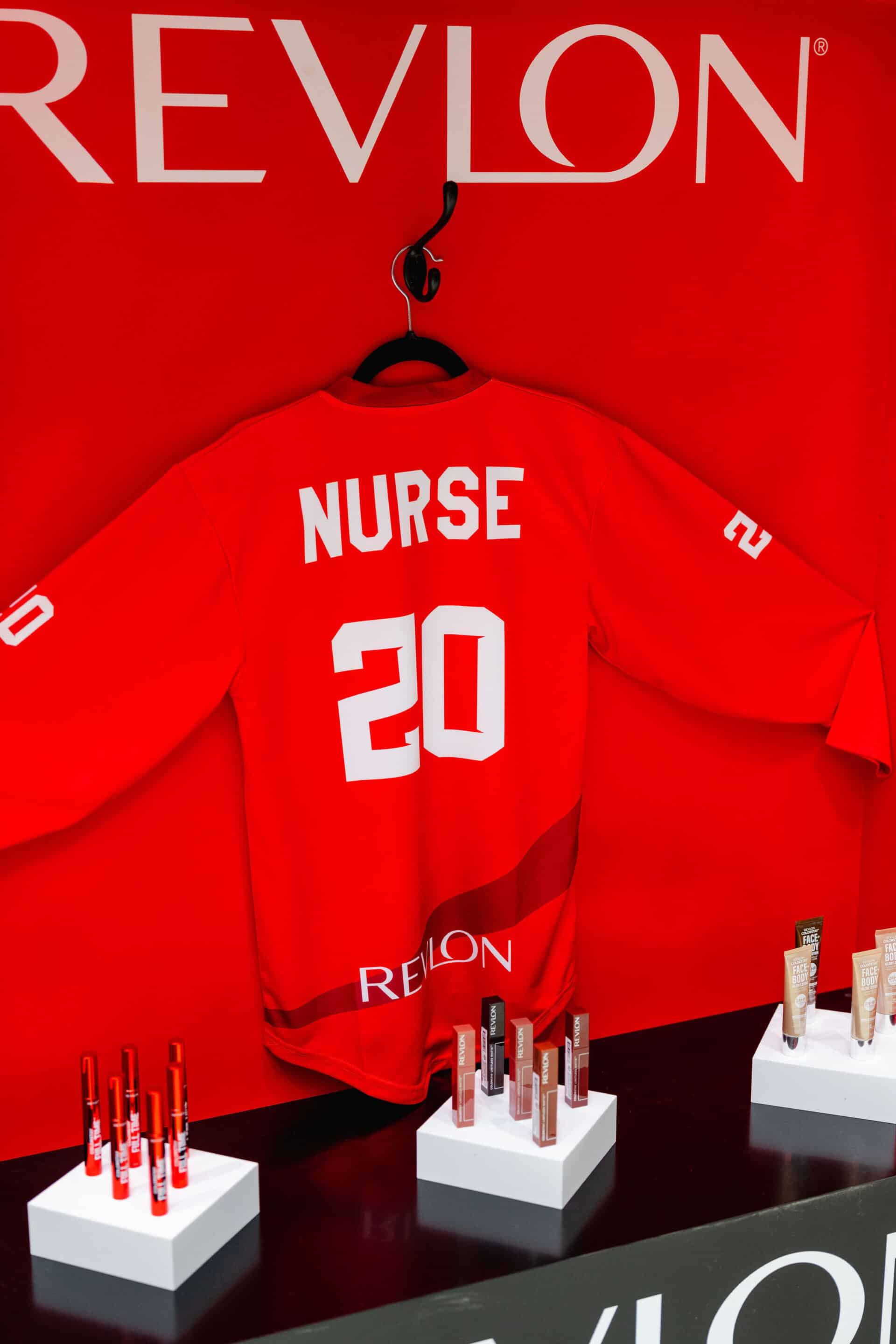 20250425-40 Revlon Hockey Themed Brand Activation - Player locker with Sarah Nurse jersey, championship banners and product display