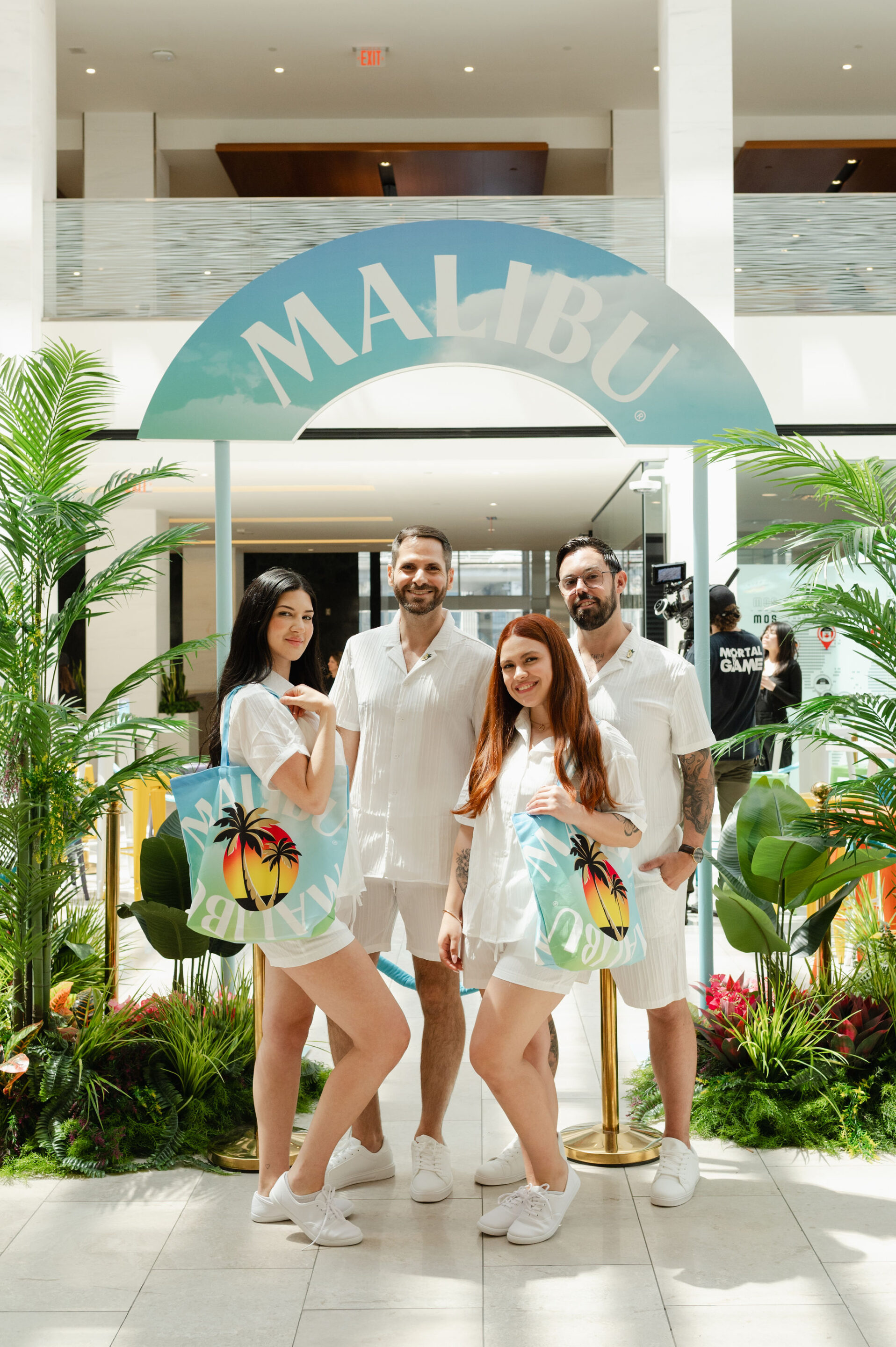 Malibu Brand Activation elevator pop up bar with colourful tropical plants and brand ambassadors