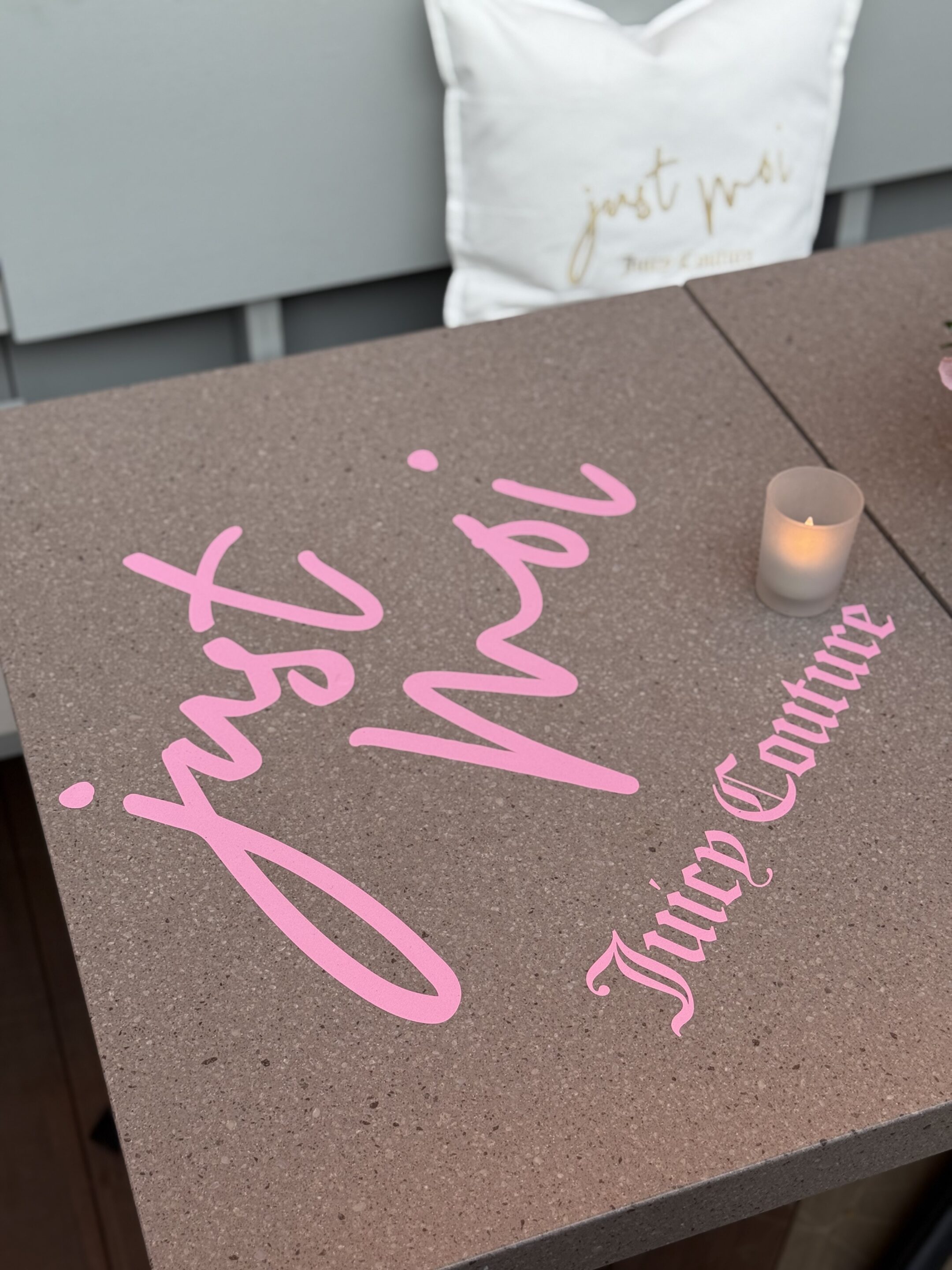 Juicy Couture Just Moi fragrance brand activation - branded tables