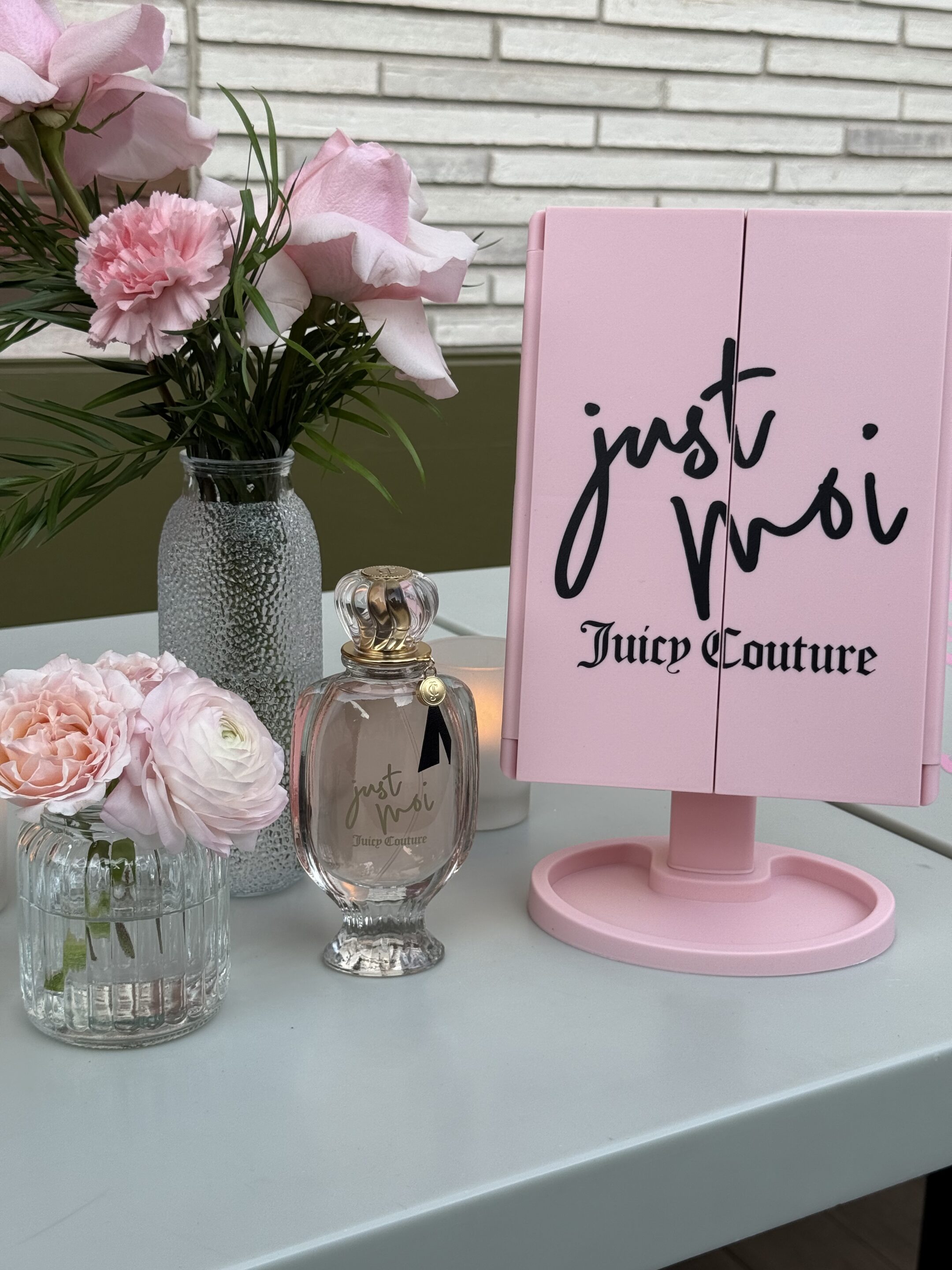 Juicy Couture Just Moi fragrance brand activation - pink floral and branded mirror